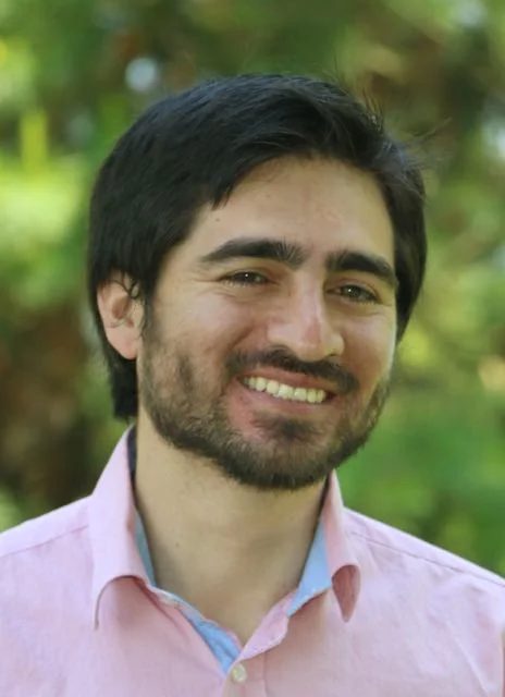 Rodrigo Toledo smiling outdoors